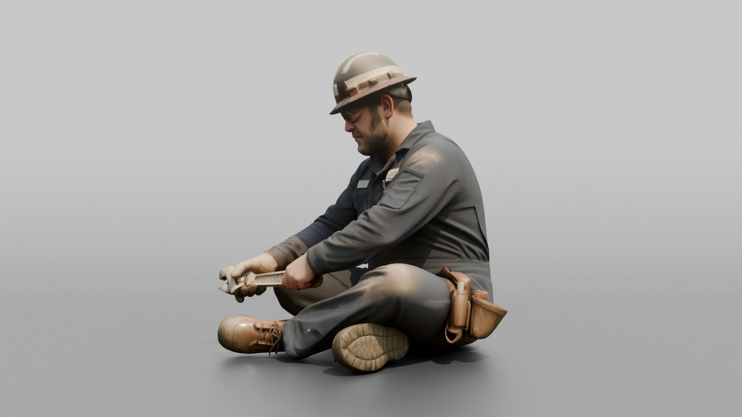 Engineer Tightening a Bolt on a Pipe Fitting