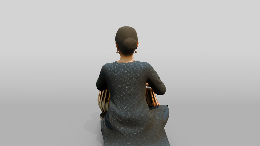 Tabla Player Seated with Twin Drums