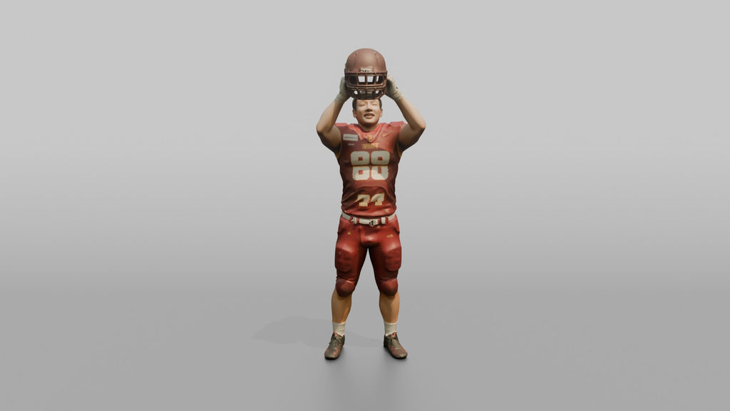 Player Raising His Helmet Triumphantly