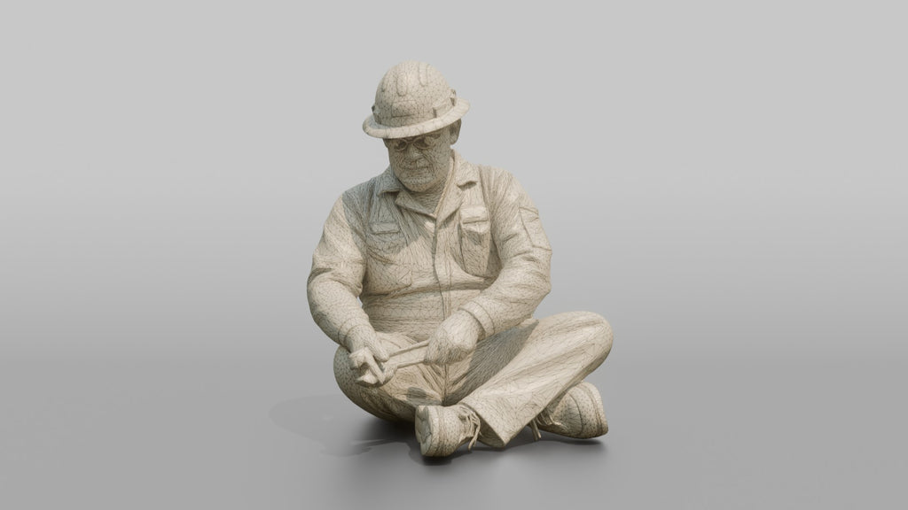 Engineer Tightening a Bolt on a Pipe Fitting