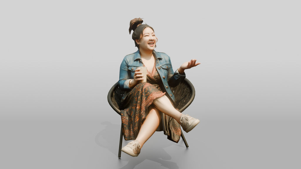 Chinese Woman Laughing While Seated with Coffee