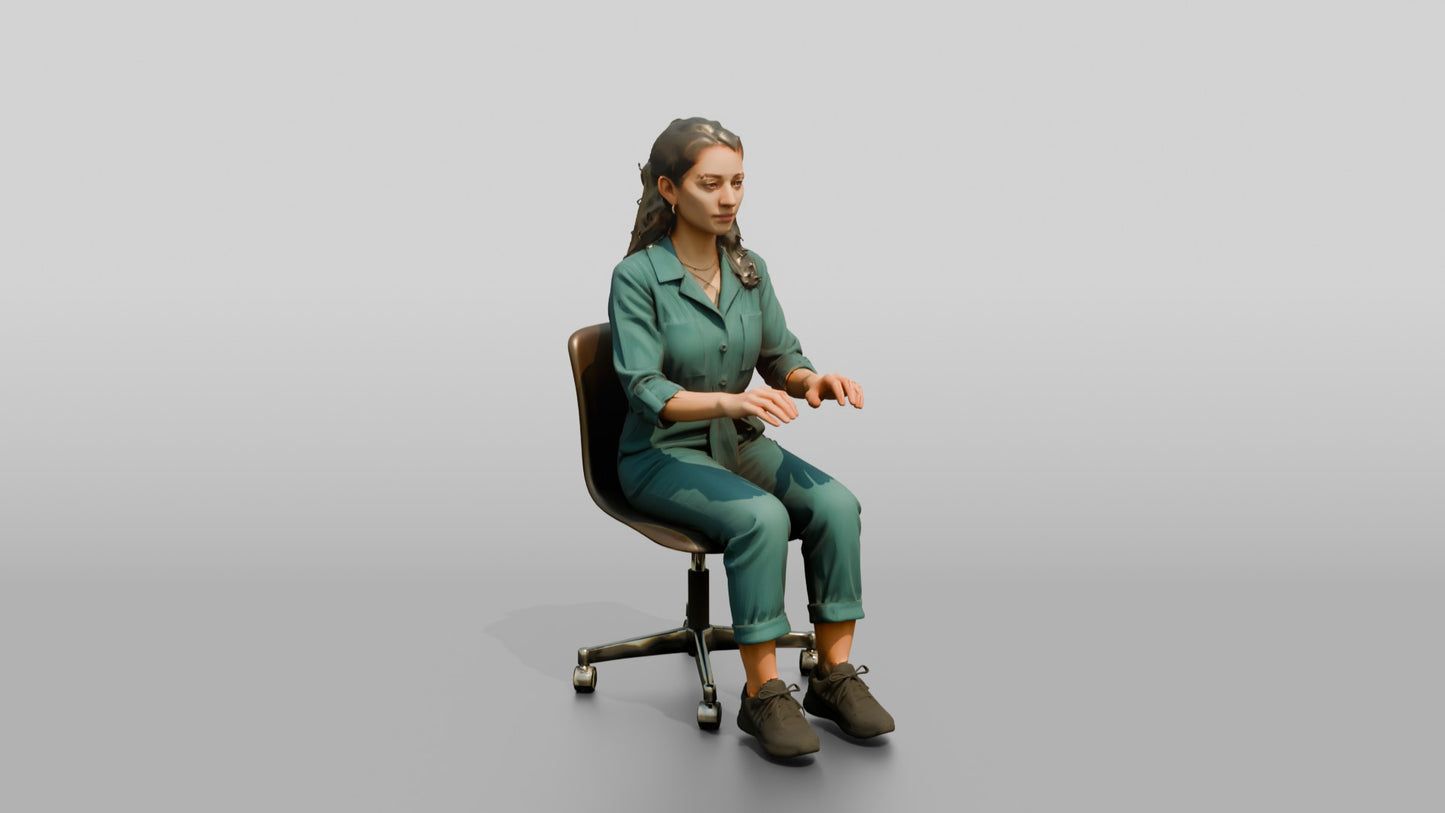 Woman Seated in a Teal Jumpsuit