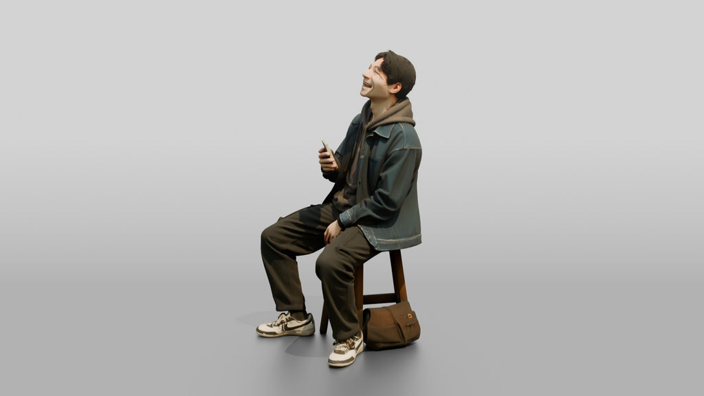 Asian Man Laughing at Phone