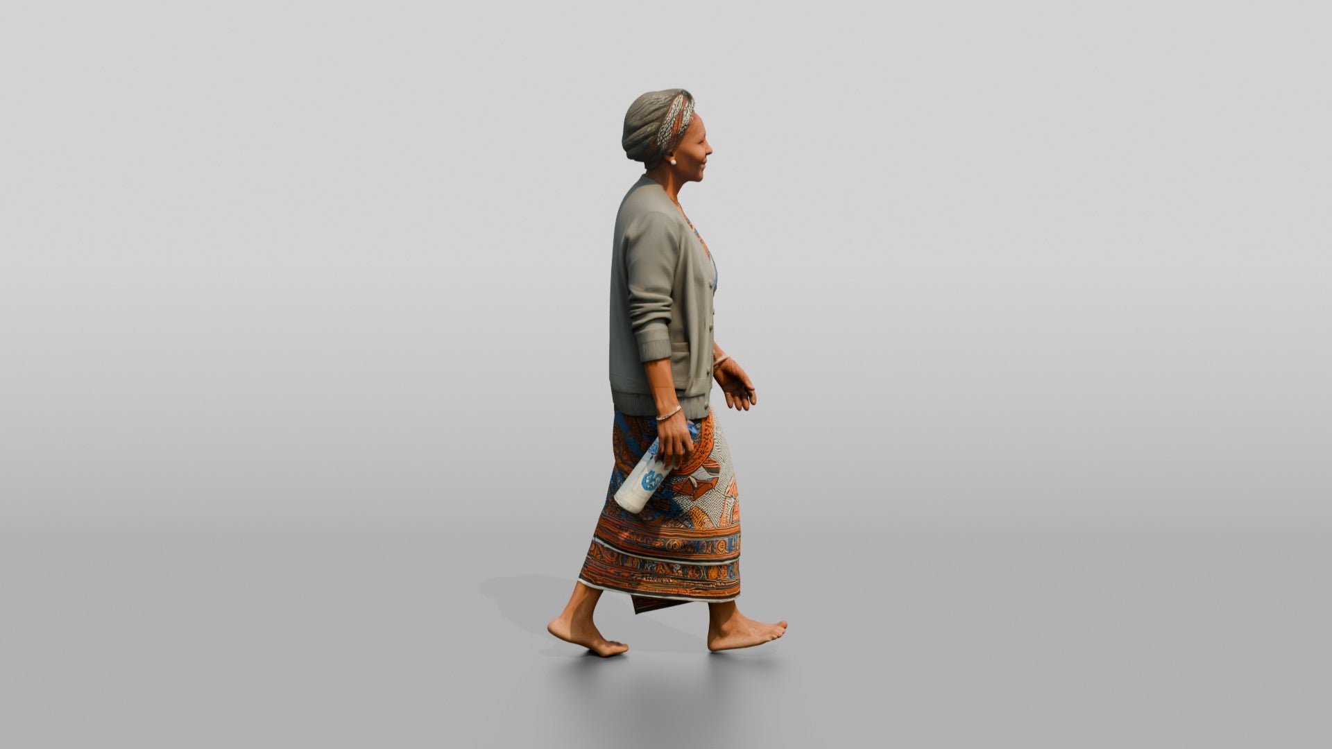 Elderly African Woman with a Water Bottle in a Wrap Dress