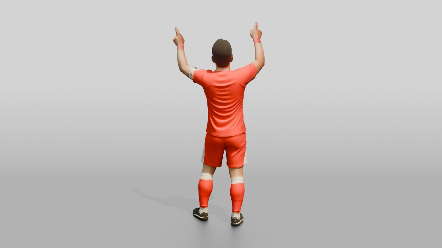 Soccer Player Pointing to the Sky