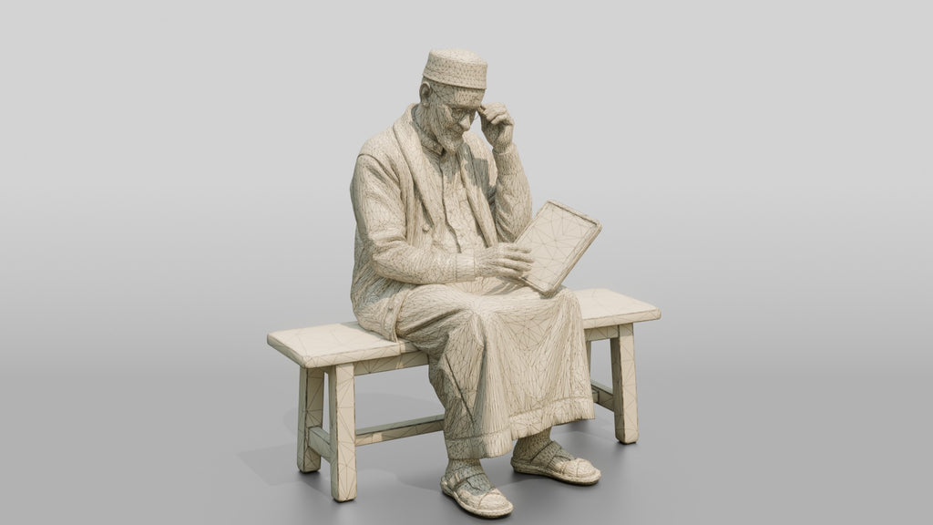 Elderly African Man Reading a Tablet on a Bench