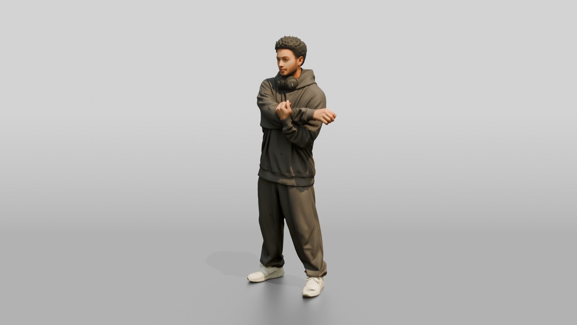 Man Stretching Arms in Oversized Hoodie