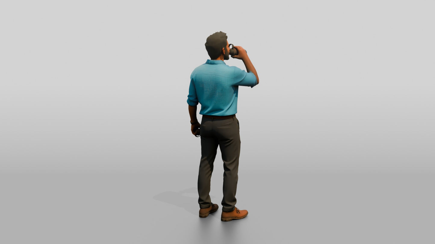 Man Sipping Coffee in a Blue Shirt