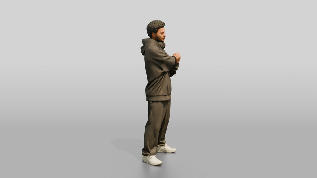 Man Stretching Arms in Oversized Hoodie