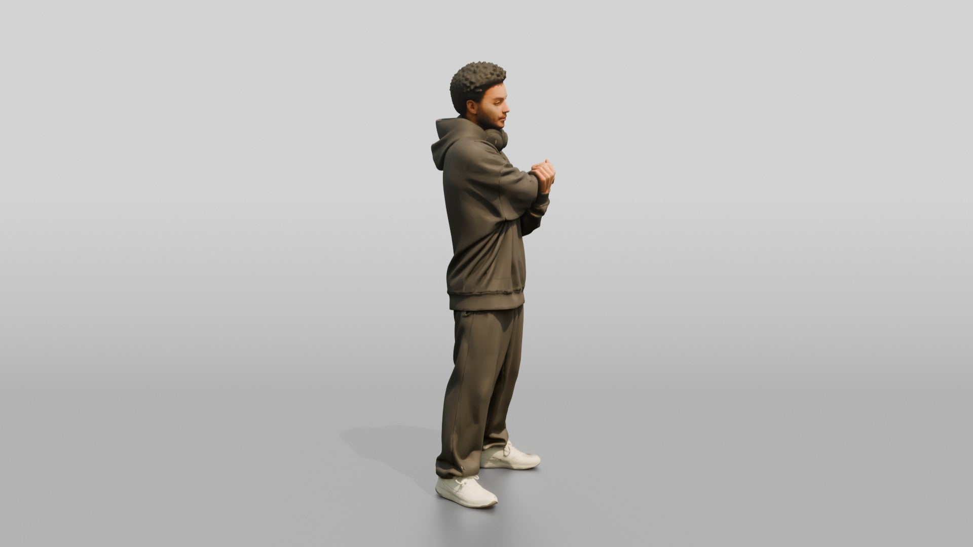 Man Stretching Arms in Oversized Hoodie