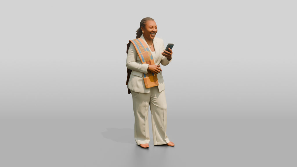 African Woman in a White Pantsuit Laughing at Her Phone