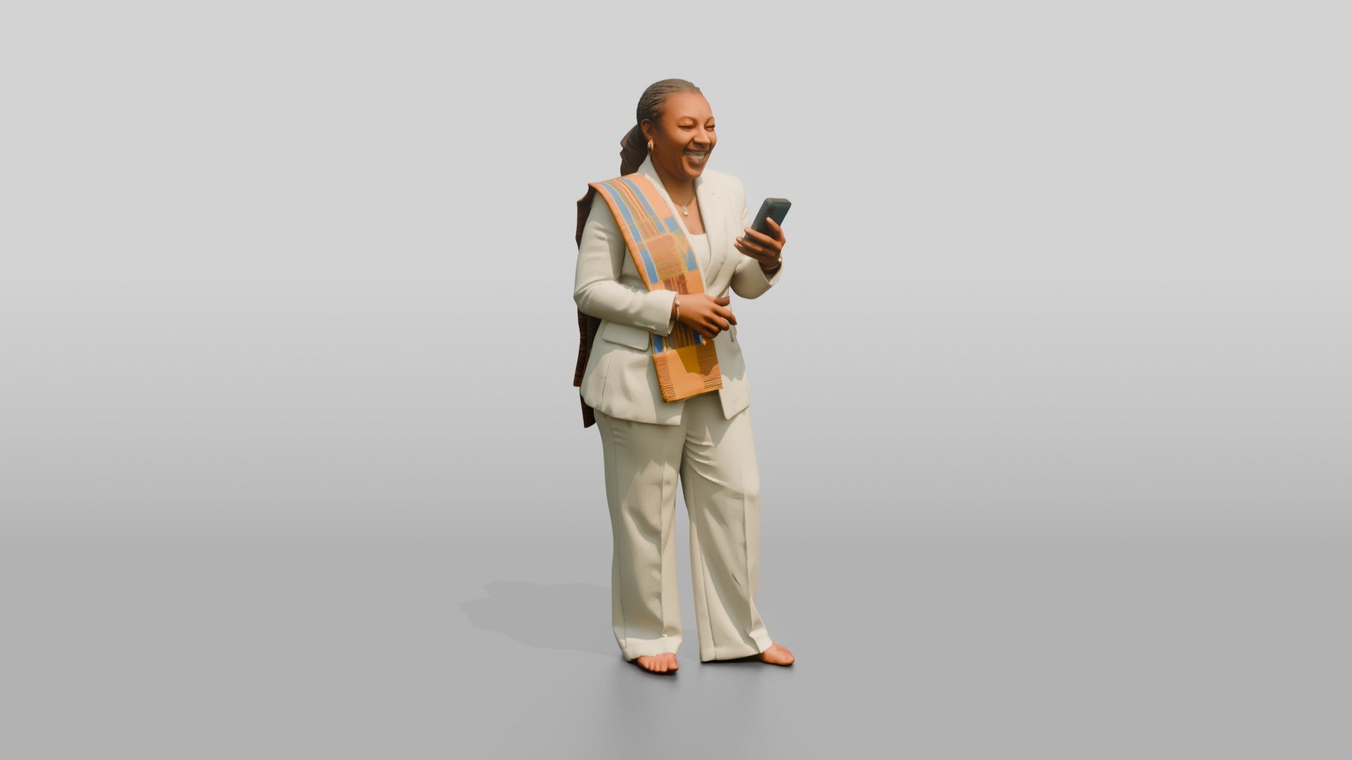 African Woman in a White Pantsuit Laughing at Her Phone