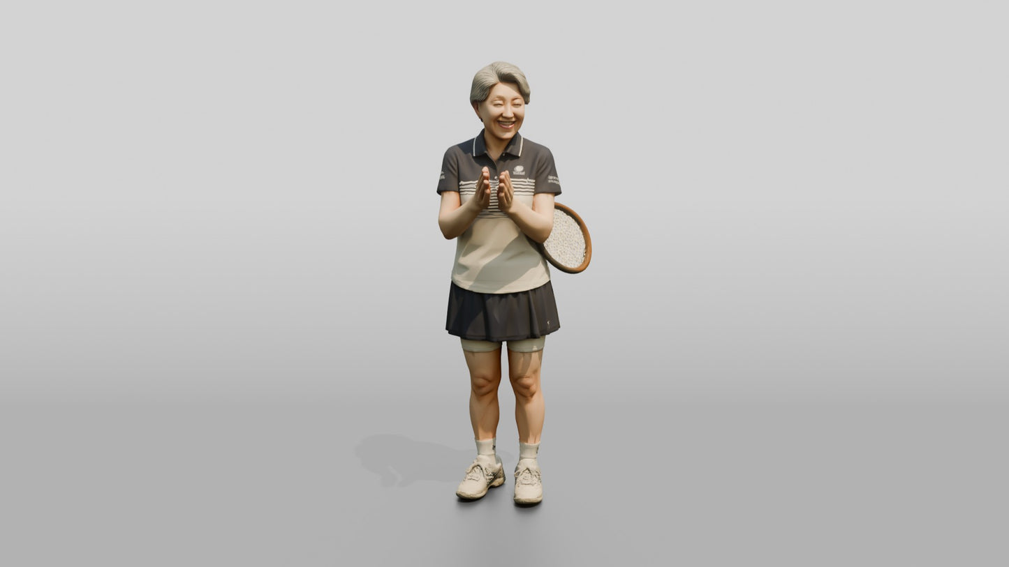 Senior Female Tennis Player Applauding a Point