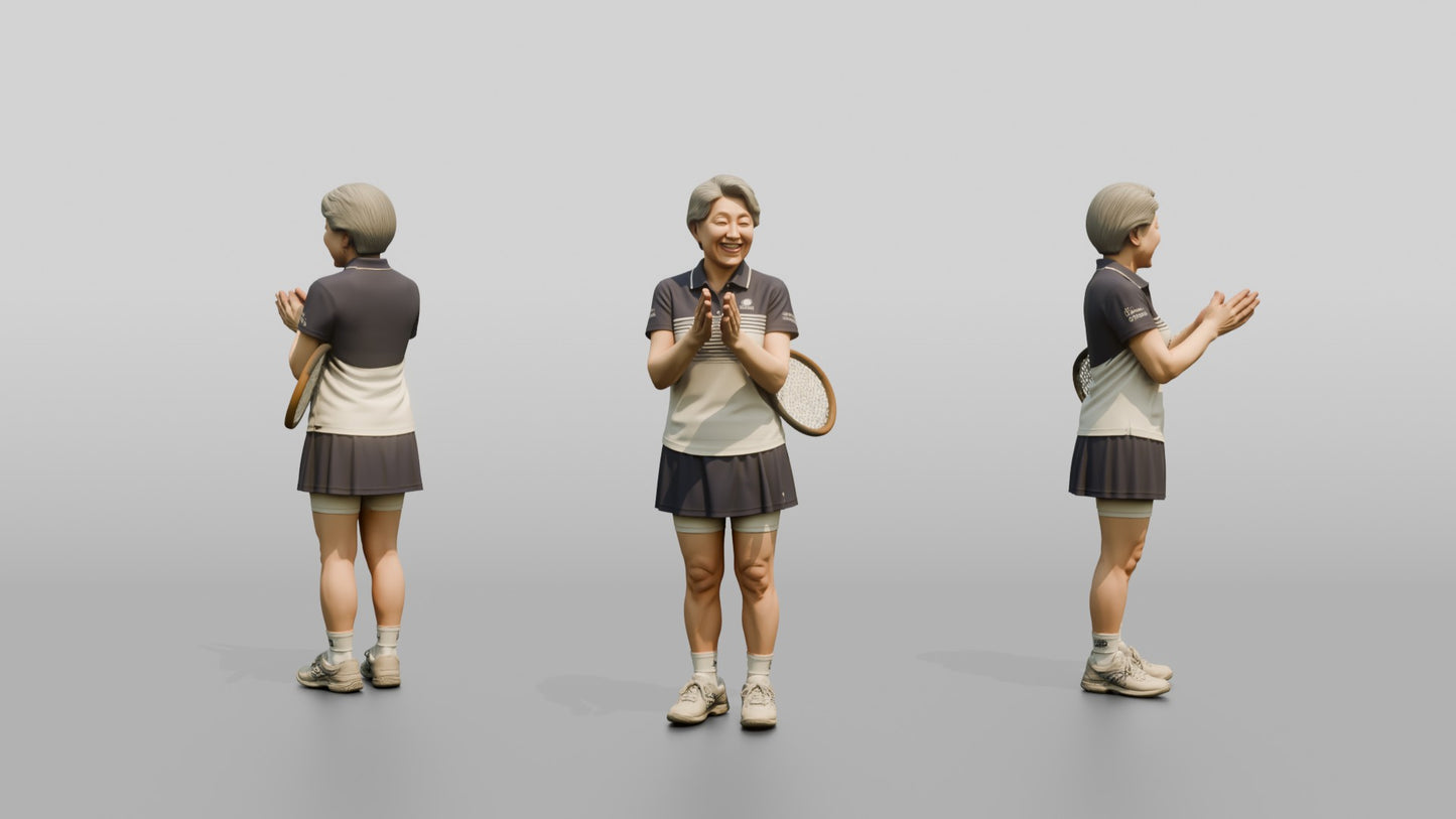 Senior Female Tennis Player Applauding a Point