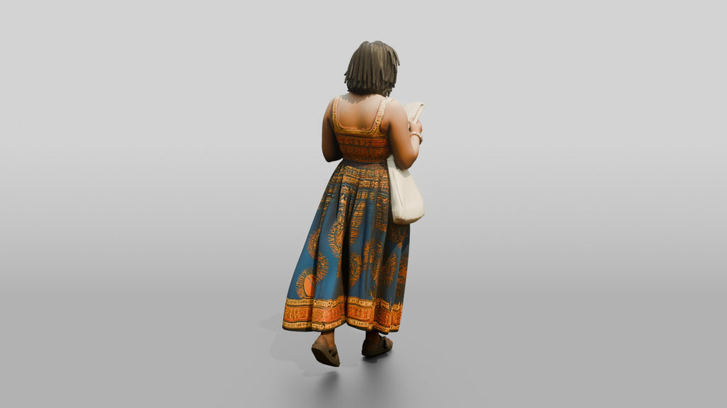 African Woman Reading a Book in a Printed Maxi Dress