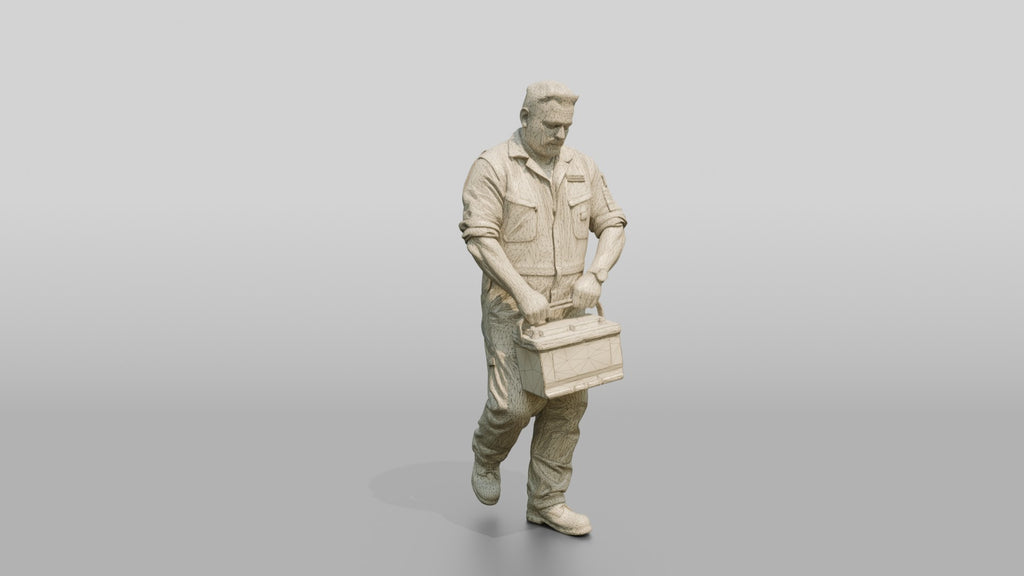 Mechanic Carrying a Car Battery