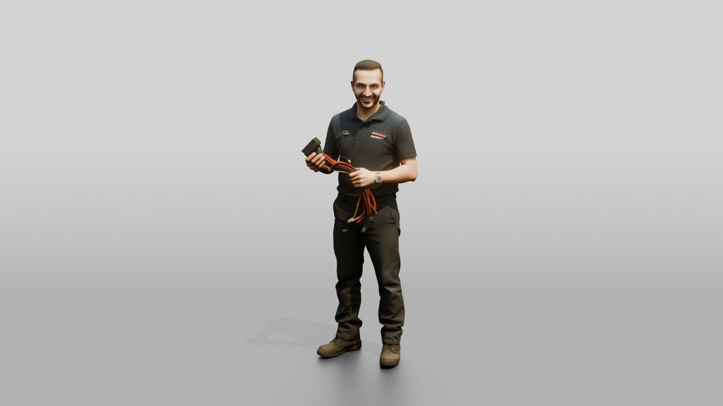 Mechanic Holding a Wire Harness Connector