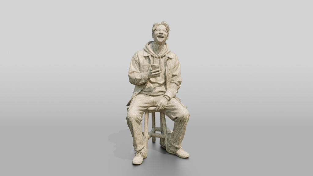 Asian Man Laughing at Phone