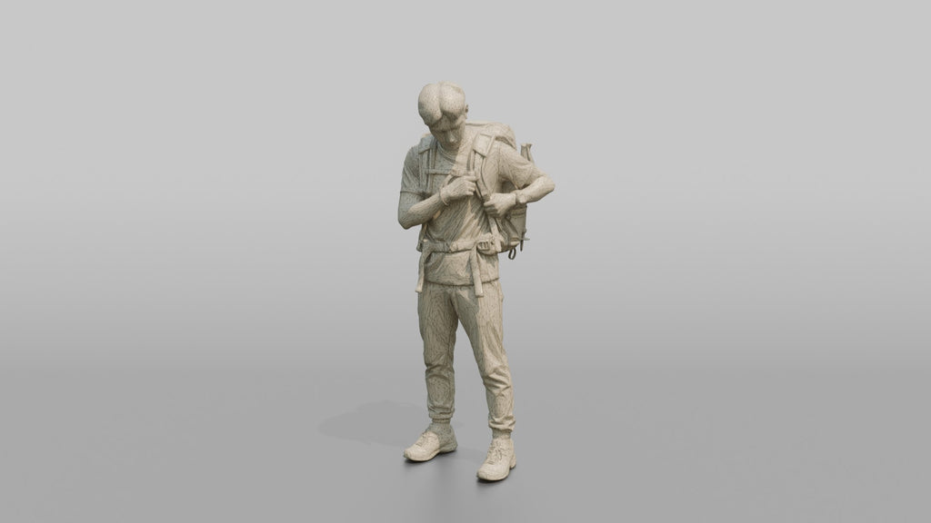 Hiker Adjusting His Backpack Strap