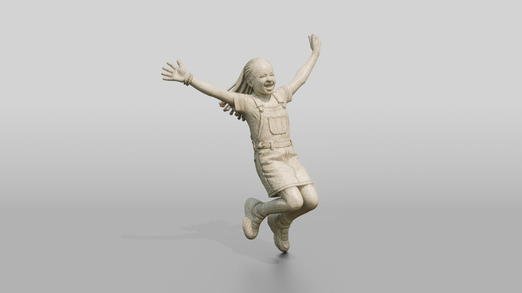 African Girl Jumping Excitedly in a Denim Overall Dress