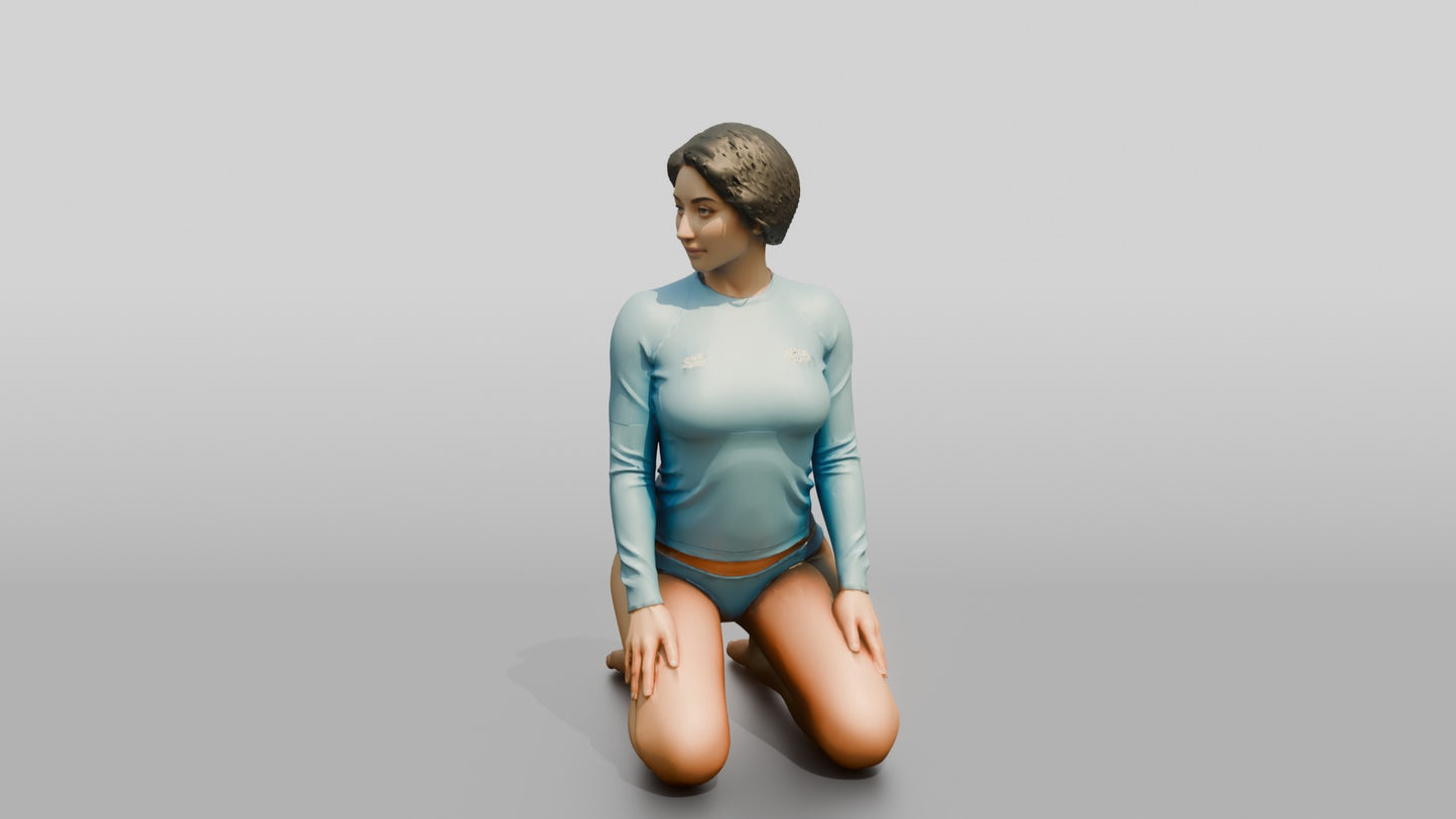 Woman in Blue Rash Guard Kneeling
