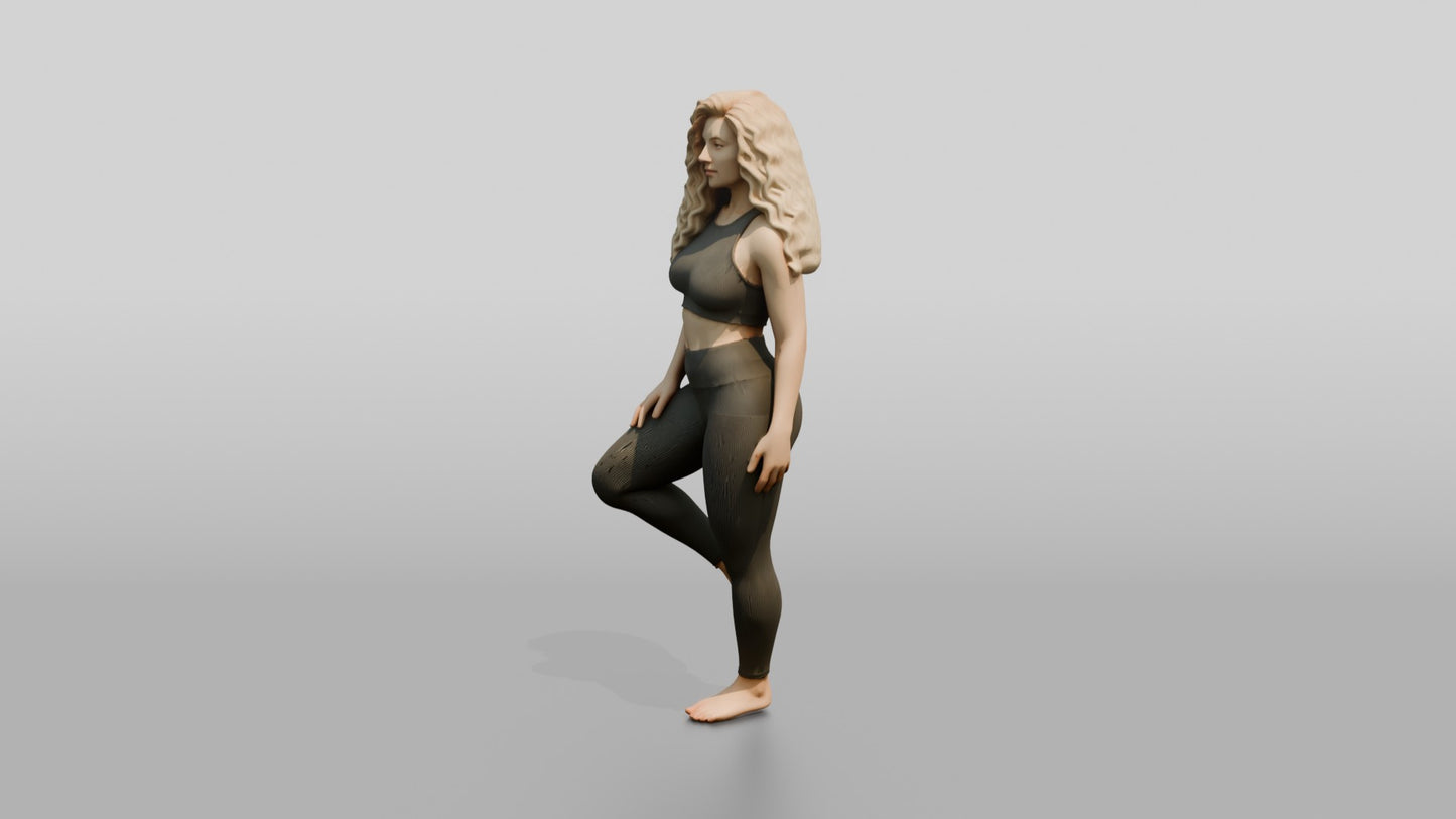 Blonde Woman in Charcoal Activewear in Tree Pose
