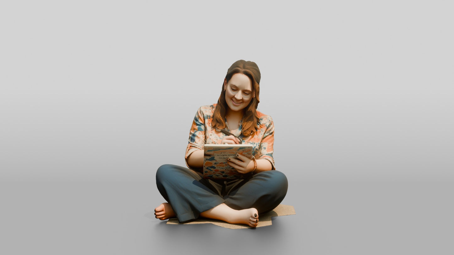 Woman Seated on the Floor with a Tablet