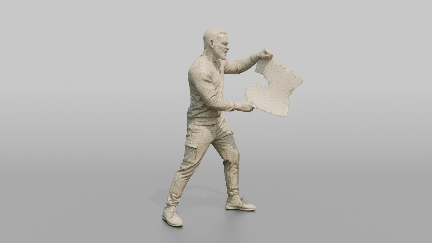 Protester Man Tearing Up a Newspaper