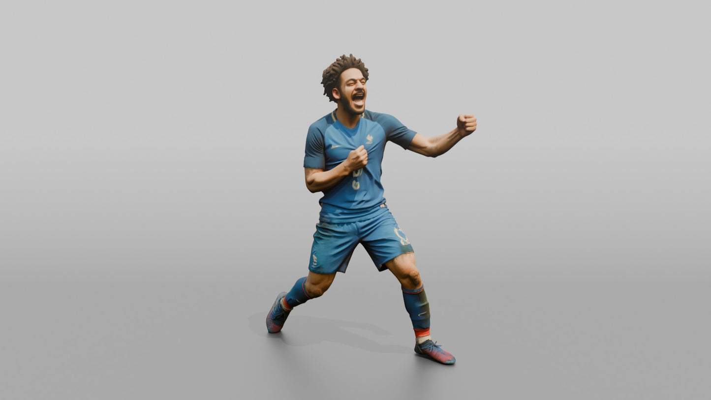 French Player Grabbing His Jersey Crest in Triumph