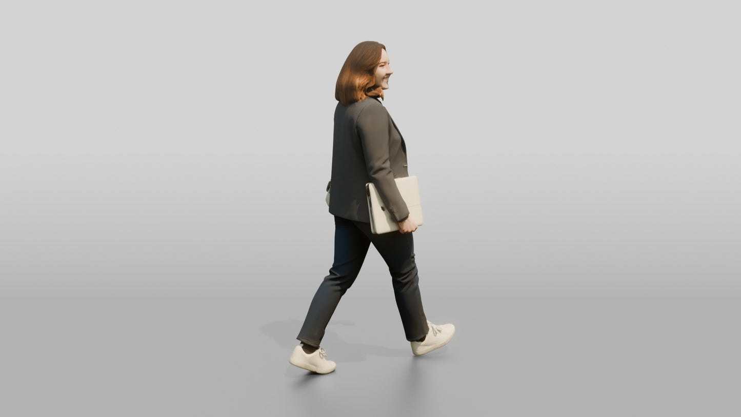 Businesswoman Walking with a Laptop
