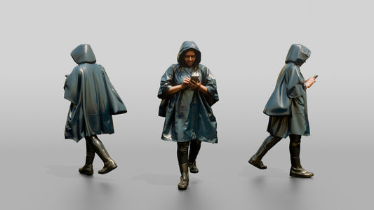 Indian Woman in Blue Poncho Checking Phone