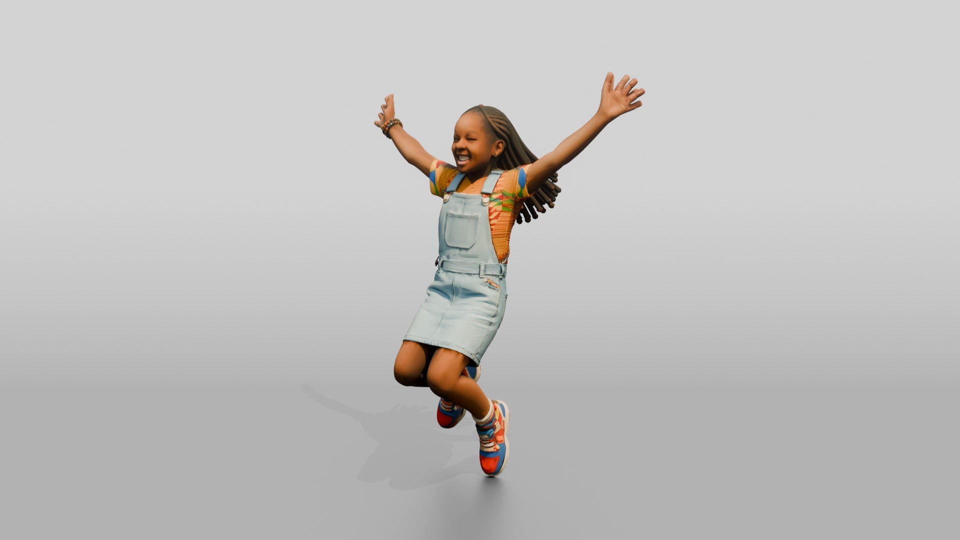 African Girl Jumping Excitedly in a Denim Overall Dress
