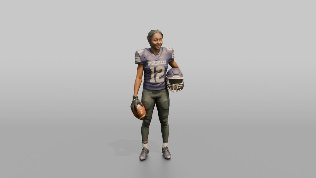Wide Receiver Standing with the Ball at Her Side