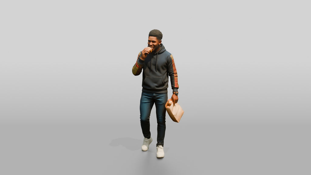 African Man in Print-Sleeve Hoodie Eating a Pastry