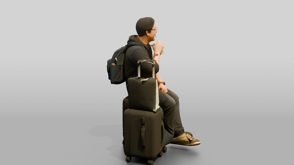 Plus-Size Asian Man Seated on Suitcase Drinking Bubble Tea