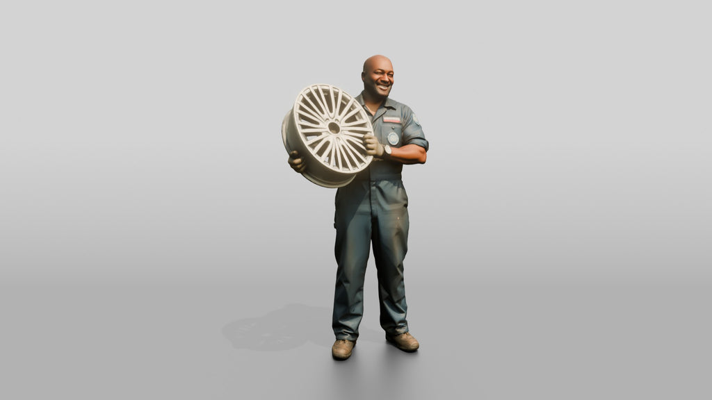 Mechanic Lifting an Alloy Wheel