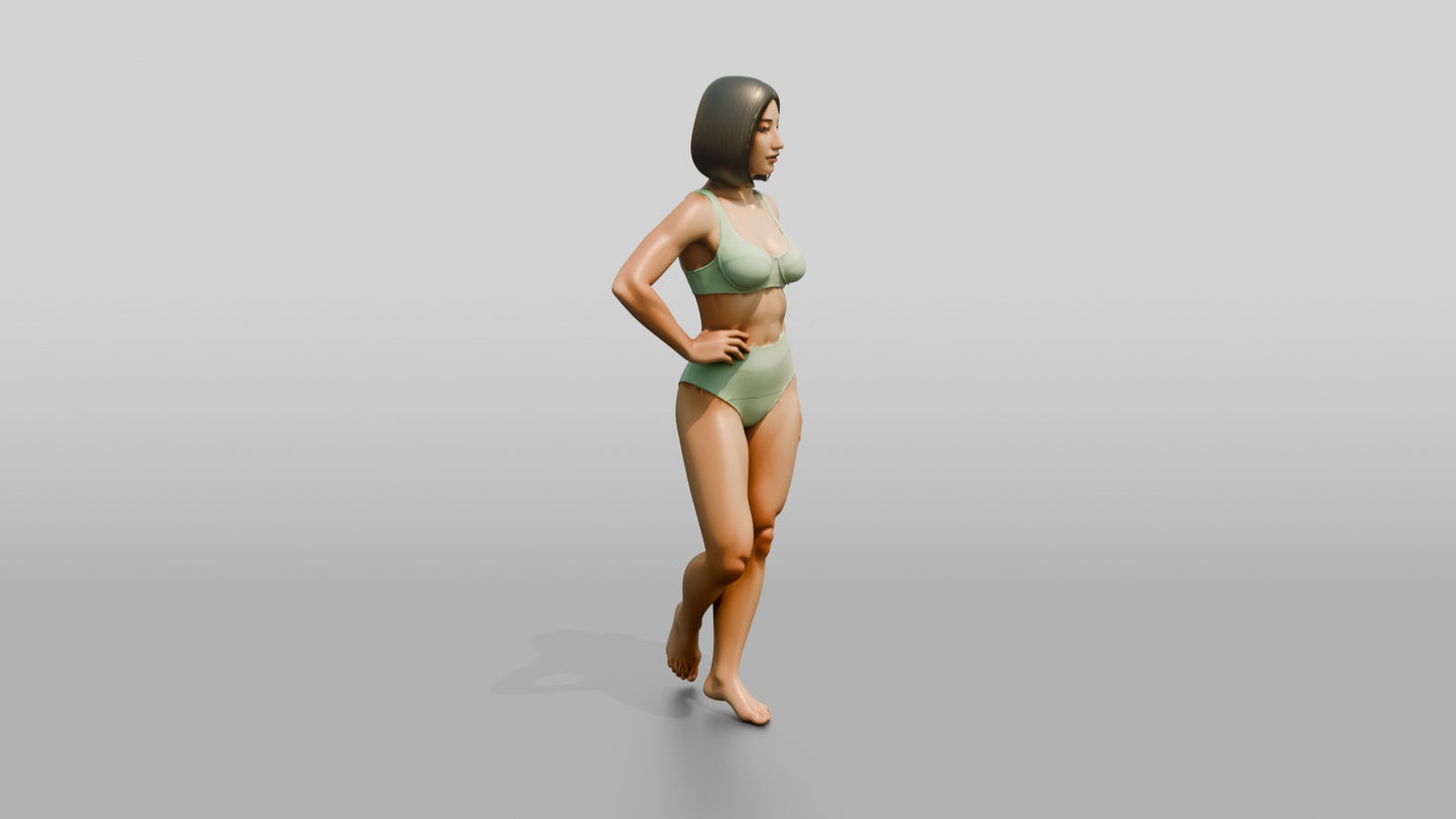 Woman in Mint Two-Piece Swimsuit with Hand on Hip