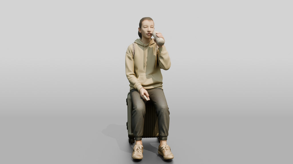 Young Woman Seated on Suitcase Drinking from Travel Cup