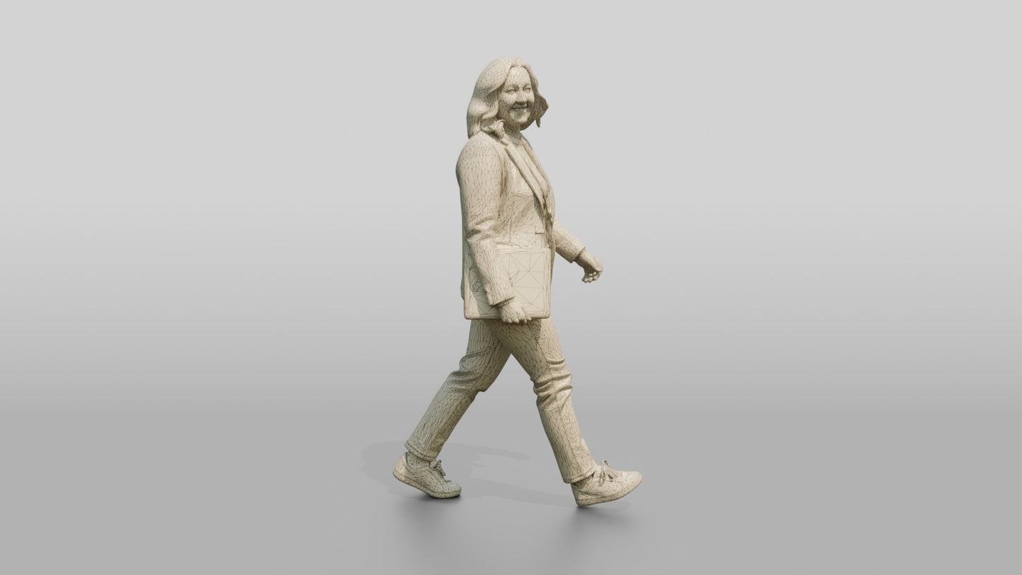 Businesswoman Walking with a Laptop