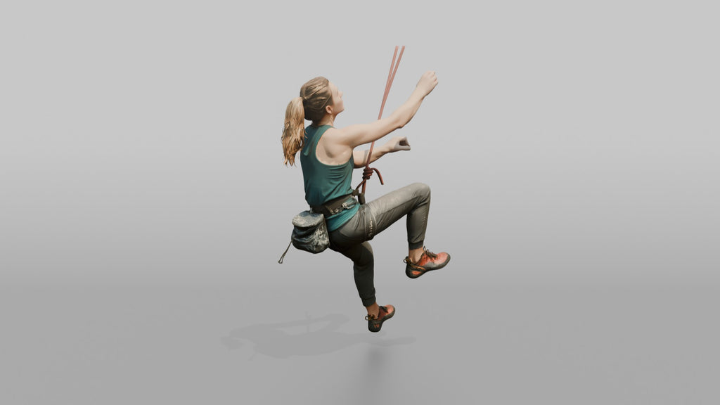Rock Climber Reaching Upward Mid-Climb