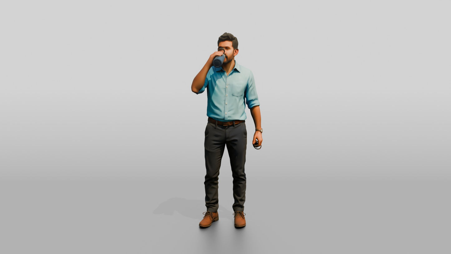 Man Sipping Coffee in a Blue Shirt