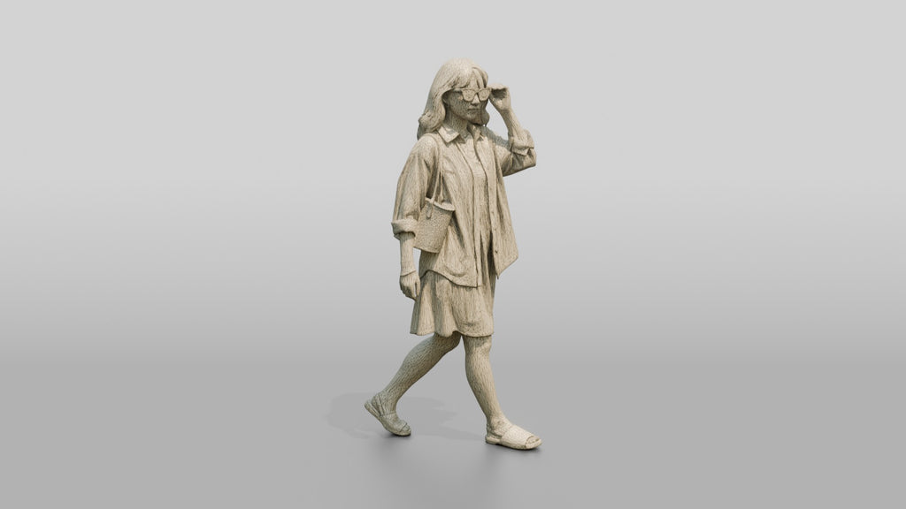 Woman Walking in Sunglasses with Straw Tote