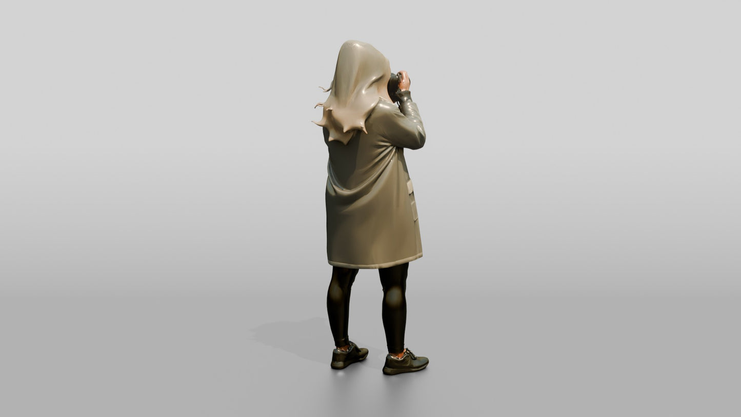 White Woman in Poncho Taking a Photo