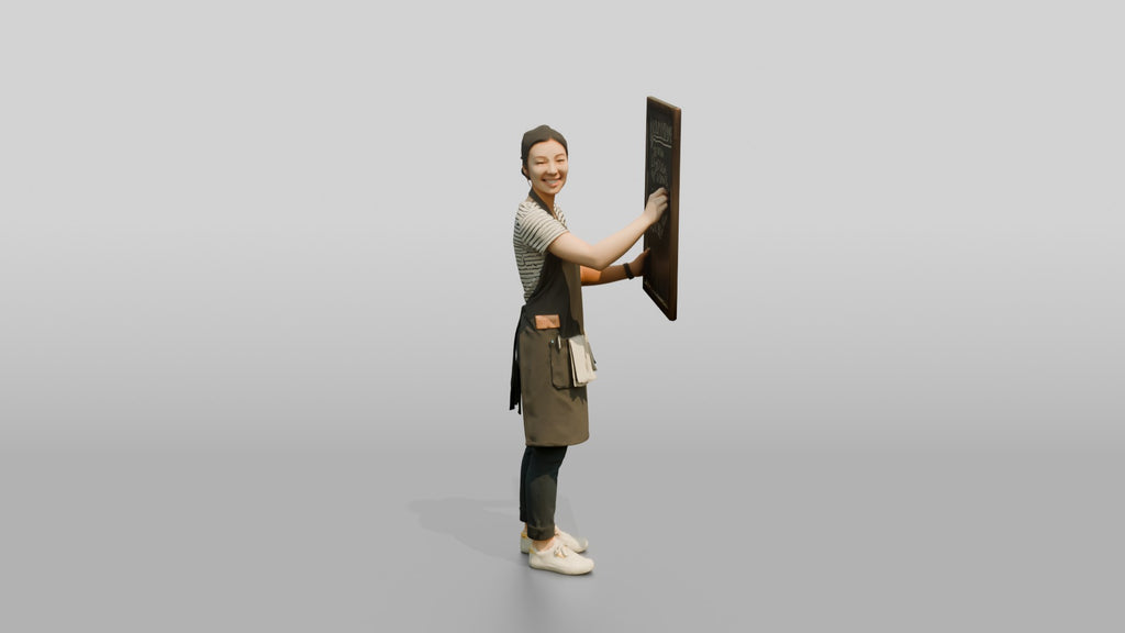East Asian Woman Barista Writing Chalk Menu