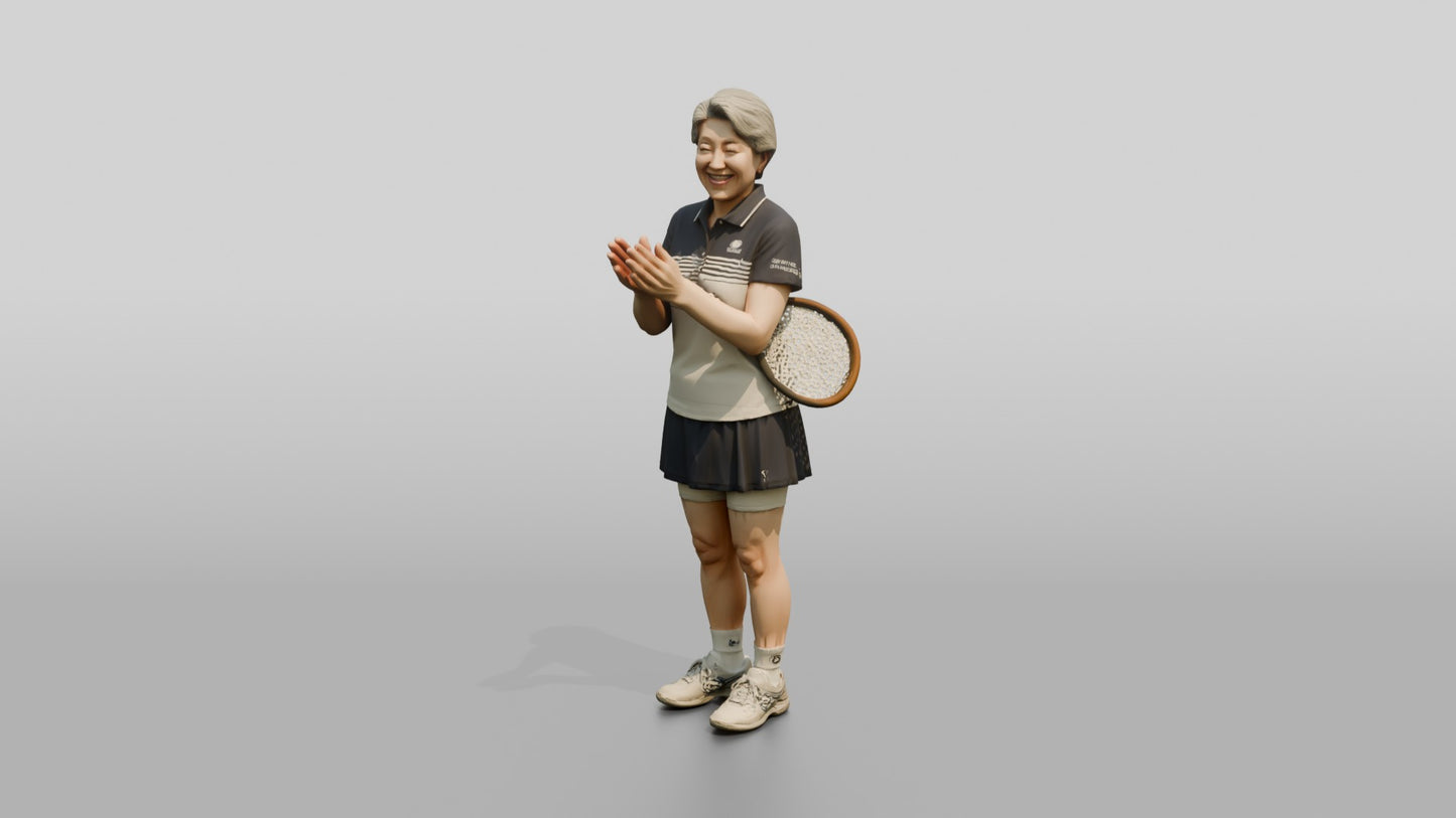 Senior Female Tennis Player Applauding a Point