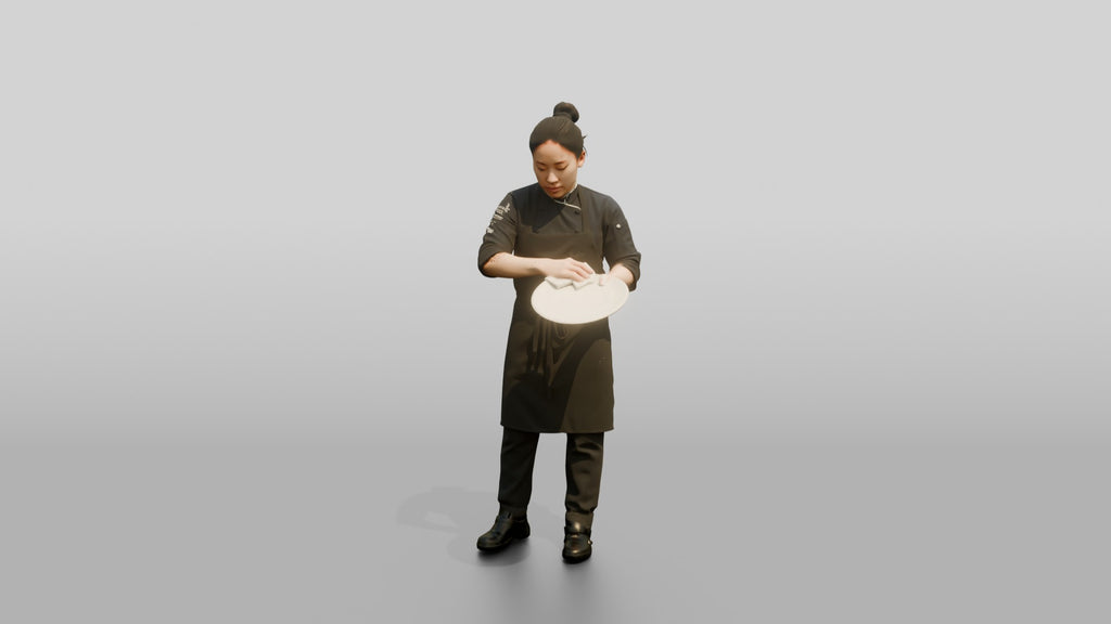 Chef Wiping a Plate Rim