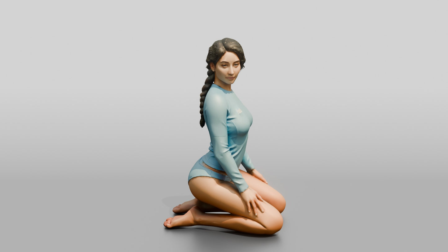 Woman in Blue Rash Guard Kneeling