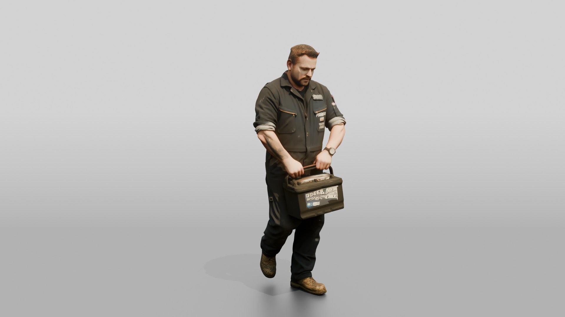 Mechanic Carrying a Car Battery