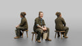 Farmer Sitting On Stool In Milking Position