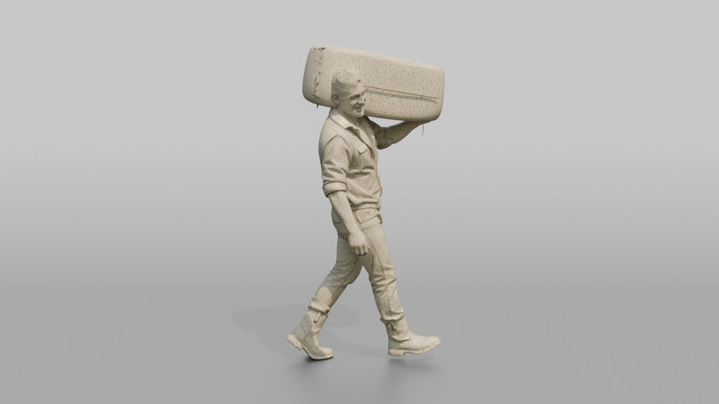 Farmer Carrying Large Bale Of Hay Over